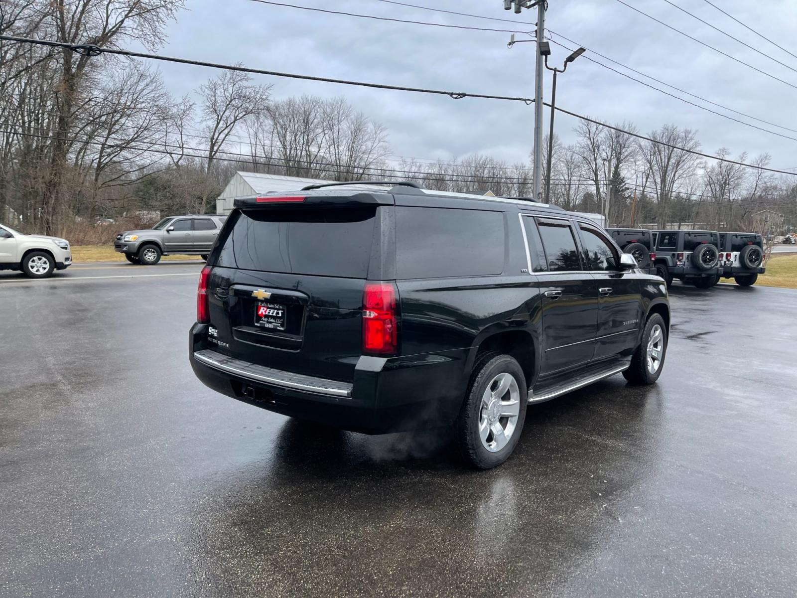 2016 Black /Brown Chevrolet Suburban LTZ 4WD (1GNSKJKC3GR) with an 5.3L V8 OHV 16V engine, 6A transmission, located at 11115 Chardon Rd. , Chardon, OH, 44024, (440) 214-9705, 41.580246, -81.241943 - This 2016 Chevrolet Suburban LTZ 4WD comes equipped with a 5.3 Vortec V8 engine and a 6-speed automatic transmission, offering a robust 8,000-pound towing capacity. It's designed with luxury and convenience in mind, featuring heated and cooled front seats, heated second-row seats, and a range of saf - Photo #9